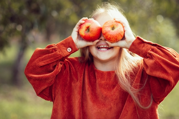 Portrait,Of,Girl,Eating,Red,Organic,Apple,Outdoor.,Harvest,Concept.
